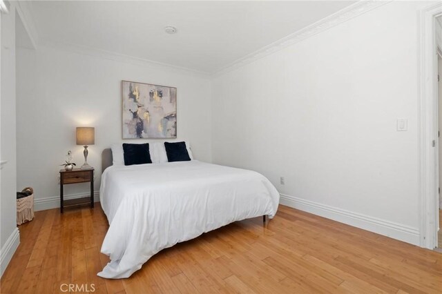 23800 Mobile St, West Hills, CA 91307 - bedroom with light wood-style flooring and crown molding