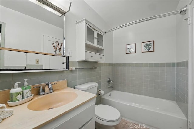 5179 Village, Los Angeles, CA 90016 - bathroom with a bath, toilet, vanity, and tile walls