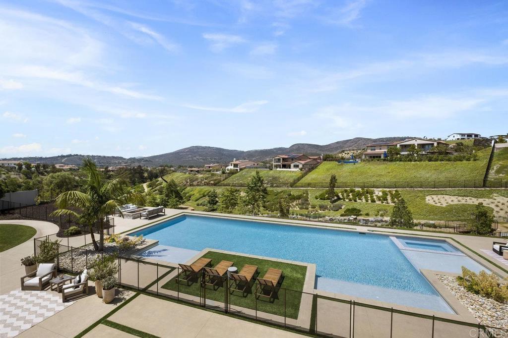 16429 Crescent Creek Dr, San Diego, CA 92127 - view of swimming pool with a patio, a mountain view, and a pool with connected hot tub