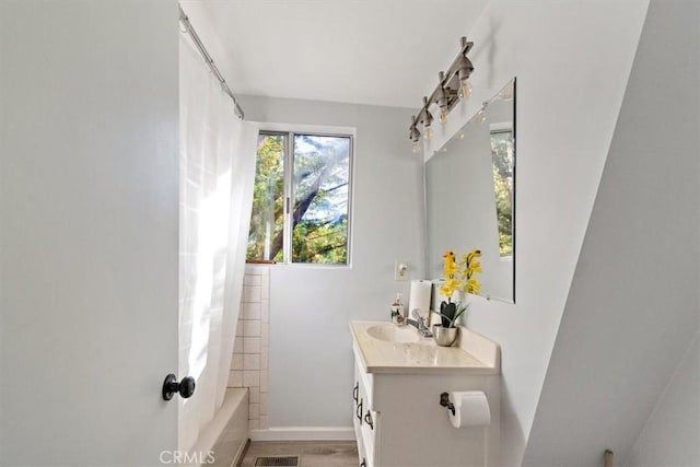 598 Dahlia Dr, Green Valley Lake, CA 92341 - bathroom featuring vanity, shower / bath combination with curtain, and baseboards