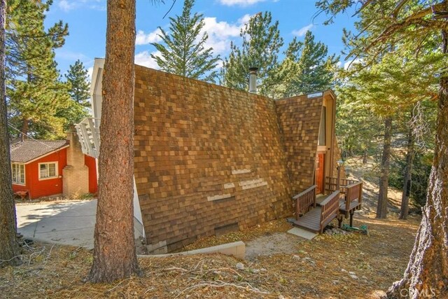 598 Dahlia Dr, Green Valley Lake, CA 92341 - view of home's exterior featuring a shingled roof