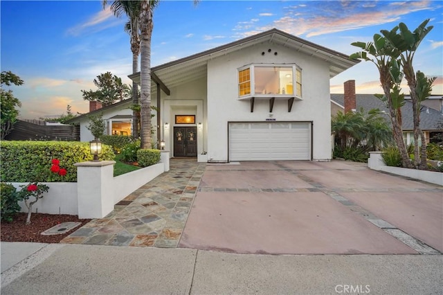 25585 Chrisanta Dr, Mission Viejo, CA 92691 - view of front facade with a garage, concrete driveway, and stucco siding
