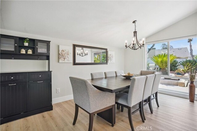 25585 Chrisanta Dr, Mission Viejo, CA 92691 - dining space with a chandelier, light wood-type flooring, baseboards, and vaulted ceiling