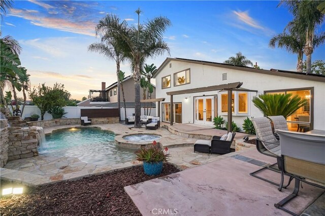 25585 Chrisanta Dr, Mission Viejo, CA 92691 - rear view of property featuring french doors, a patio area, stucco siding, a fenced backyard, and a pool with connected hot tub