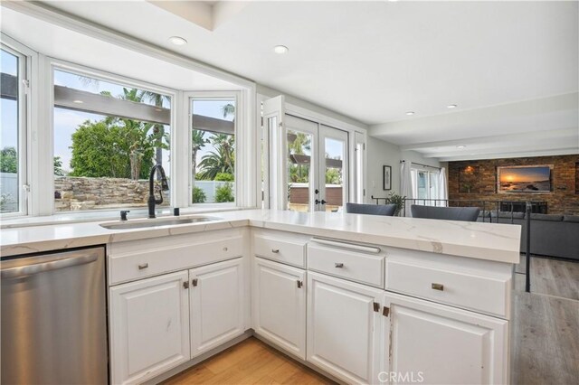 25585 Chrisanta Dr, Mission Viejo, CA 92691 - kitchen featuring stainless steel dishwasher, a sink, healthy amount of natural light, light wood-style floors, and recessed lighting