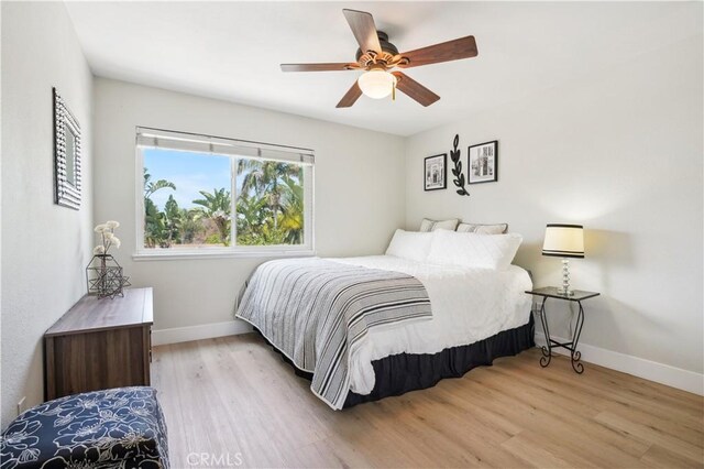25585 Chrisanta Dr, Mission Viejo, CA 92691 - bedroom with baseboards, wood finished floors, and ceiling fan