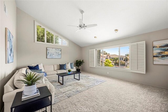 45 Colonial, Irvine, CA 92620 - living room with ceiling fan, healthy amount of natural light, carpet, vaulted ceiling, and baseboards