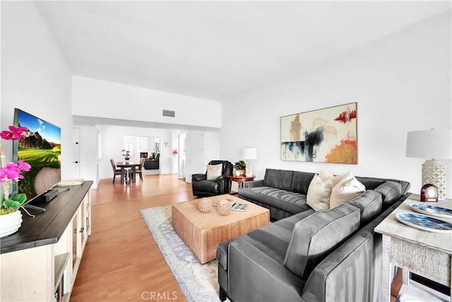 5509 Paseo Del Lago W Unit C, Laguna Woods, CA 92637 - living room featuring light wood-style flooring