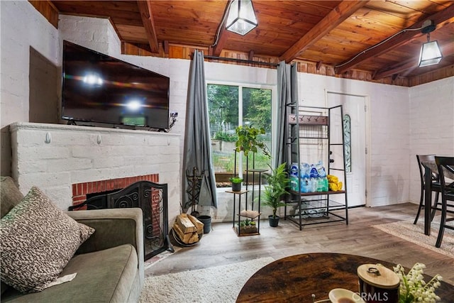423 Forest Ln, Crestline, CA 92325 - living area with wood ceiling with exposed beams, wood finished floors, and a brick fireplace