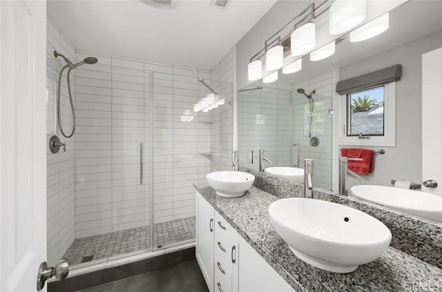 1526 Garden St, San Luis Obispo, CA 93401 - bathroom featuring a stall shower, double vanity, and tile patterned floors