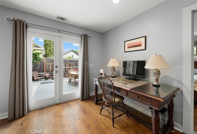 1526 Garden St, San Luis Obispo, CA 93401 - home office featuring french doors, hardwood / wood-style floors, and recessed lighting