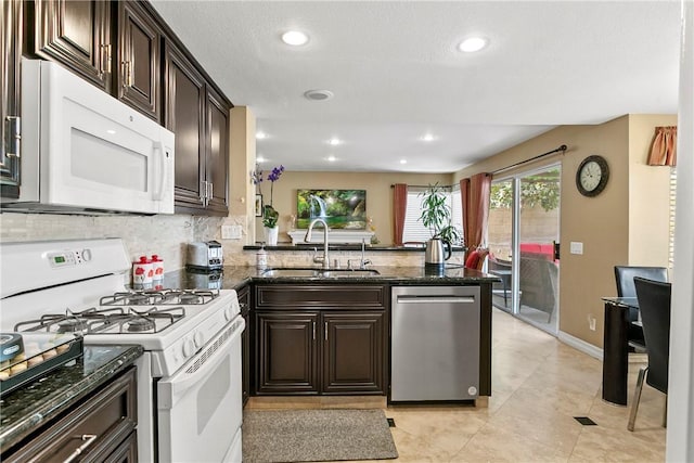 902 Highland View Dr, Corona, CA 92882 - kitchen with white appliances, a sink, healthy amount of natural light, dark brown cabinets, and recessed lighting