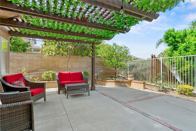 902 Highland View Dr, Corona, CA 92882 - fenced backyard with a pergola, a patio area, and an outdoor living space