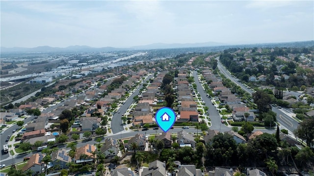 902 Highland View Dr, Corona, CA 92882 - aerial overview of property's location with a mountain backdrop and nearby suburban area