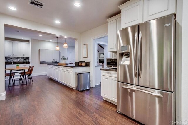 1530 Stewart St, Oceanside, CA 92054 - kitchen featuring stainless steel fridge with ice dispenser, dark countertops, white cabinetry, and recessed lighting