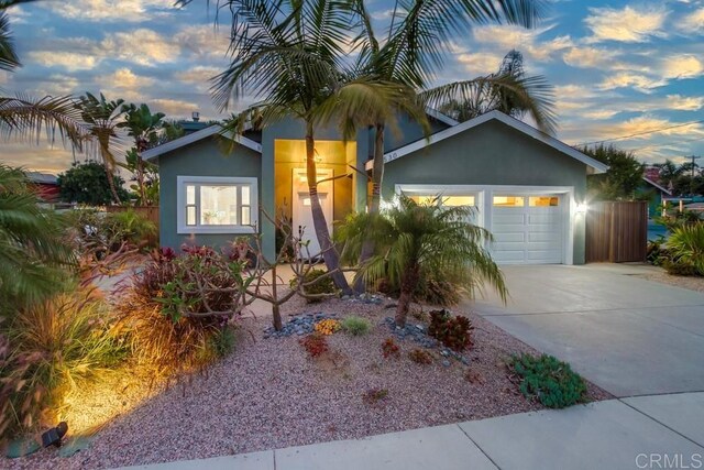 1530 Stewart St, Oceanside, CA 92054 - view of front of property with a garage, concrete driveway, and stucco siding