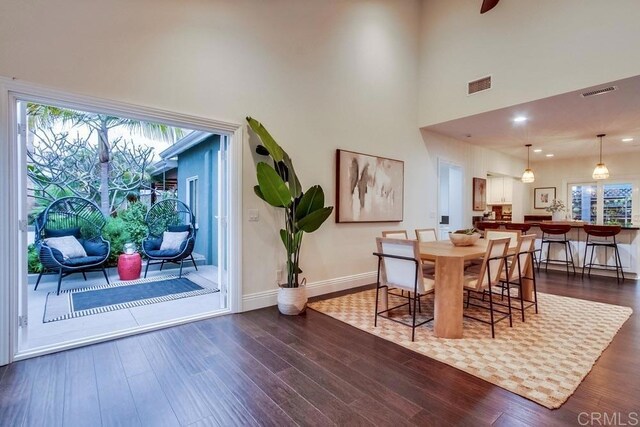 1530 Stewart St, Oceanside, CA 92054 - dining area with dark wood finished floors, a high ceiling, baseboards, and recessed lighting