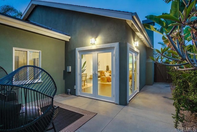 1530 Stewart St, Oceanside, CA 92054 - view of exterior entry with stucco siding, french doors, and a patio