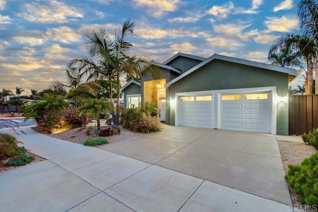 1530 Stewart St, Oceanside, CA 92054 - ranch-style home with stucco siding, a garage, and concrete driveway