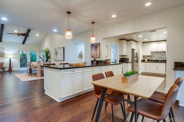 1530 Stewart St, Oceanside, CA 92054 - dining space featuring recessed lighting, dark wood-style floors, vaulted ceiling, and ceiling fan