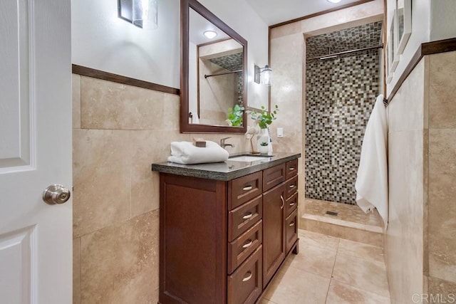 1530 Stewart St, Oceanside, CA 92054 - bathroom featuring tile walls, tiled shower, vanity, and tile patterned flooring