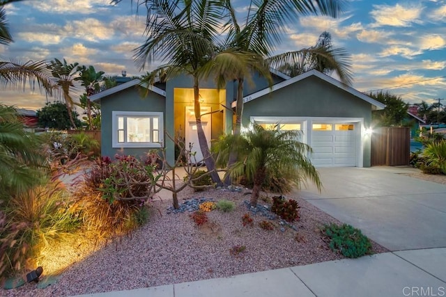1530 Stewart St, Oceanside, CA 92054 - view of front of house featuring driveway, a garage, and stucco siding