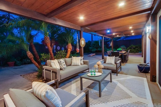 1530 Stewart St, Oceanside, CA 92054 - patio at twilight with an outdoor living space, a patio area, outdoor dining space, a fenced backyard, and ceiling fan