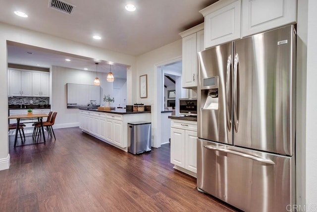 1530 Stewart St, Oceanside, CA 92054 - kitchen with stainless steel fridge, dark countertops, white cabinetry, and recessed lighting