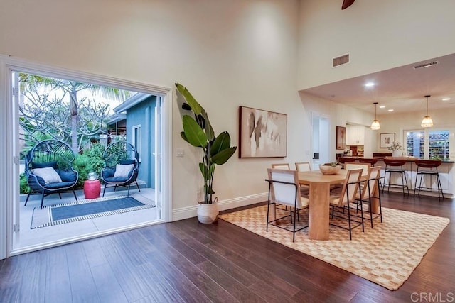 1530 Stewart St, Oceanside, CA 92054 - dining room with dark wood-style flooring, a towering ceiling, and recessed lighting
