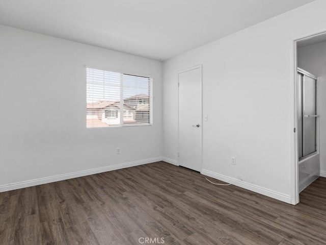 26230 Monticello Way, Murrieta, CA 92563 - unfurnished bedroom featuring dark wood-style floors and baseboards