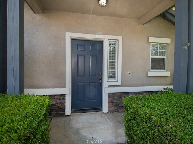 26230 Monticello Way, Murrieta, CA 92563 - property entrance with stucco siding and stone siding