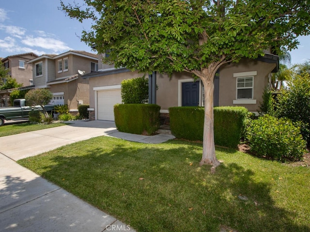 26230 Monticello Way, Murrieta, CA 92563 - view of property hidden behind natural elements with a garage, driveway, a front yard, and stucco siding