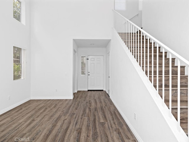 26230 Monticello Way, Murrieta, CA 92563 - staircase featuring a high ceiling, wood finished floors, and baseboards