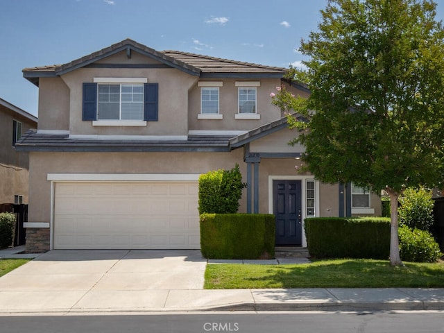 26230 Monticello Way, Murrieta, CA 92563 - view of front of property with an attached garage, concrete driveway, stucco siding, and a tile roof