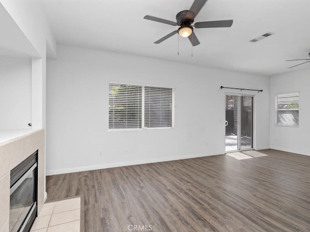 26230 Monticello Way, Murrieta, CA 92563 - unfurnished living room with a ceiling fan, a tile fireplace, wood finished floors, and baseboards