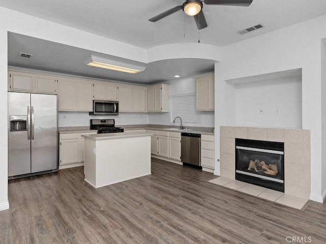 26230 Monticello Way, Murrieta, CA 92563 - kitchen featuring stainless steel appliances, a sink, a ceiling fan, light countertops, and dark wood-type flooring