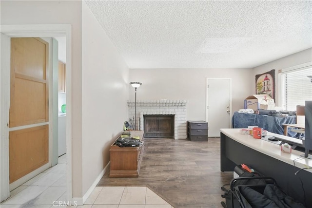 918 Sequoia Ct, San Dimas, CA 91773 - living area featuring a textured ceiling, a fireplace, and light wood-type flooring