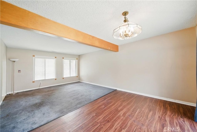 918 Sequoia Ct, San Dimas, CA 91773 - empty room with baseboards, a chandelier, beam ceiling, wood finished floors, and a textured ceiling