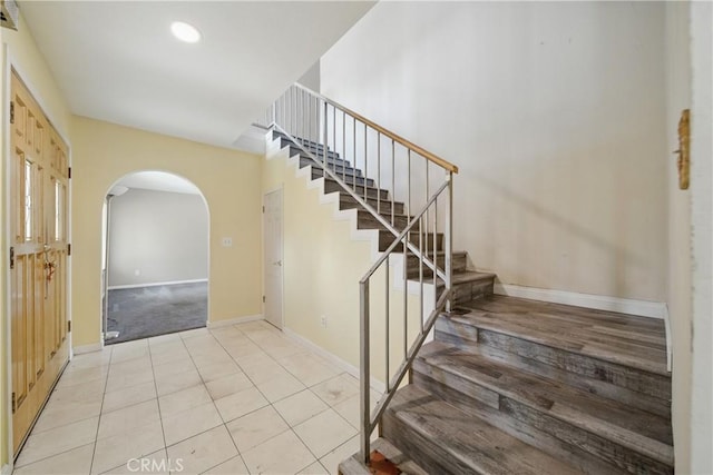 918 Sequoia Ct, San Dimas, CA 91773 - stairs featuring arched walkways, baseboards, tile patterned floors, carpet flooring, and recessed lighting