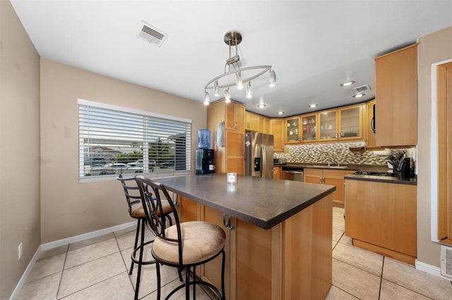 8644 Spring Vista Way, Spring Valley, CA 91977 - kitchen with appliances with stainless steel finishes, dark countertops, light tile patterned floors, a sink, and recessed lighting