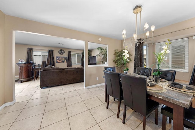 8644 Spring Vista Way, Spring Valley, CA 91977 - dining area featuring a chandelier, baseboards, and light tile patterned flooring
