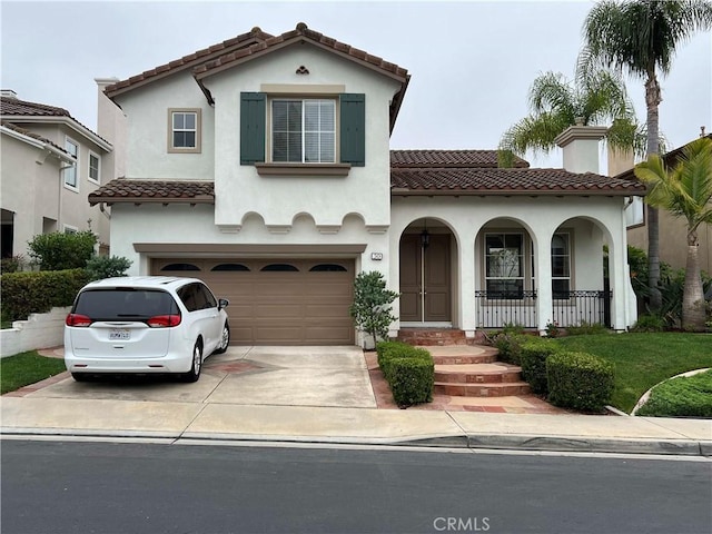 30 Sunswept Mesa, Aliso Viejo, CA 92656 - mediterranean / spanish-style house with a tile roof, a garage, covered porch, stucco siding, and driveway