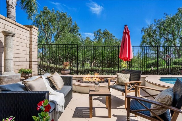 30 Sunswept Mesa, Aliso Viejo, CA 92656 - view of patio / terrace featuring an outdoor living space with a fire pit