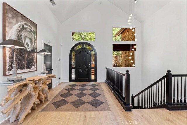 1019 Pintail Cir, Lake Arrowhead, CA 92352 - entryway with high vaulted ceiling and wood finished floors