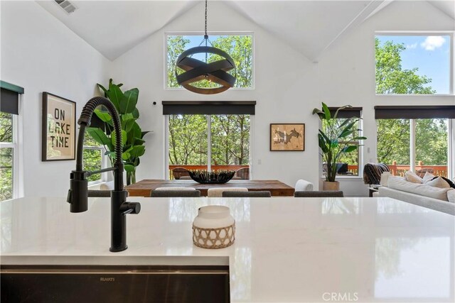 1019 Pintail Cir, Lake Arrowhead, CA 92352 - kitchen with high vaulted ceiling, open floor plan, healthy amount of natural light, and pendant lighting