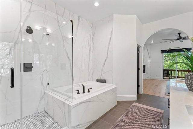 1019 Pintail Cir, Lake Arrowhead, CA 92352 - full bath with a marble finish shower, a bath, a ceiling fan, tile patterned flooring, and recessed lighting