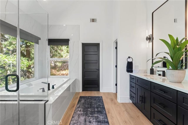 1019 Pintail Cir, Lake Arrowhead, CA 92352 - bathroom featuring vanity, a bath, and wood finished floors