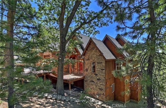 1019 Pintail Cir, Lake Arrowhead, CA 92352 - view of home's exterior featuring stone siding and a deck