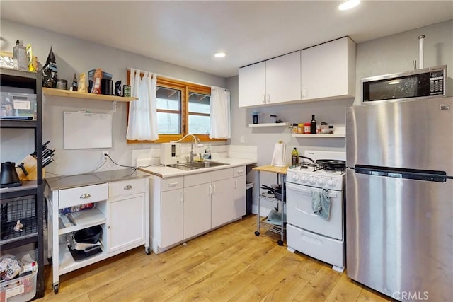 2289 Falcon Ridge Ln, Los Osos, CA 93402 - kitchen with stainless steel appliances, open shelves, white cabinetry, and recessed lighting
