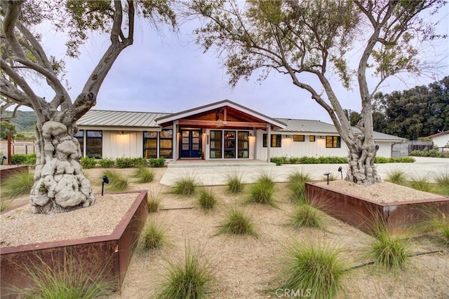 2289 Falcon Ridge Ln, Los Osos, CA 93402 - back of house featuring a metal roof, board and batten siding, a standing seam roof, and french doors